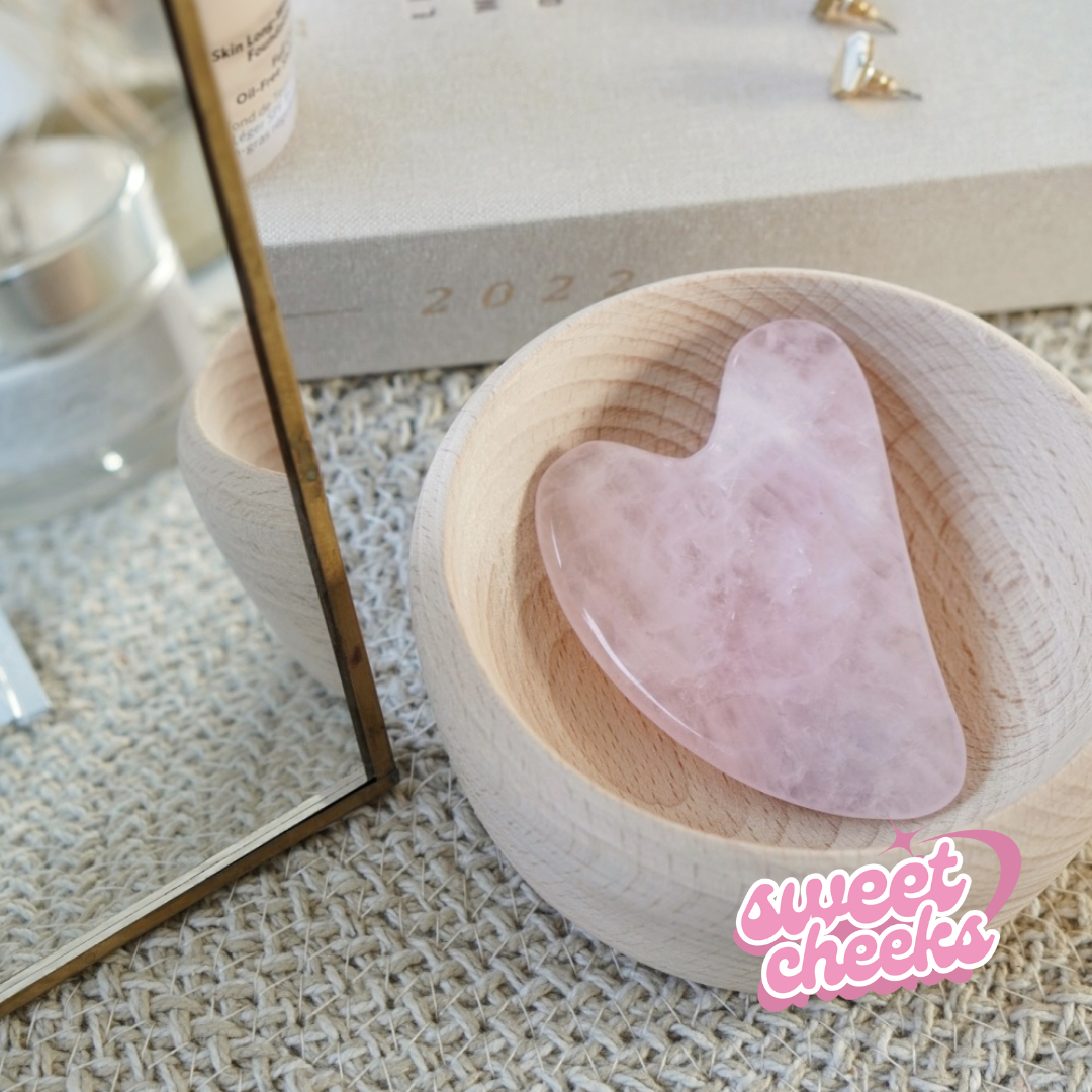 Rose Quartz Crystal Gua Sha with Black Skull Pouch - Sweet Cheeks