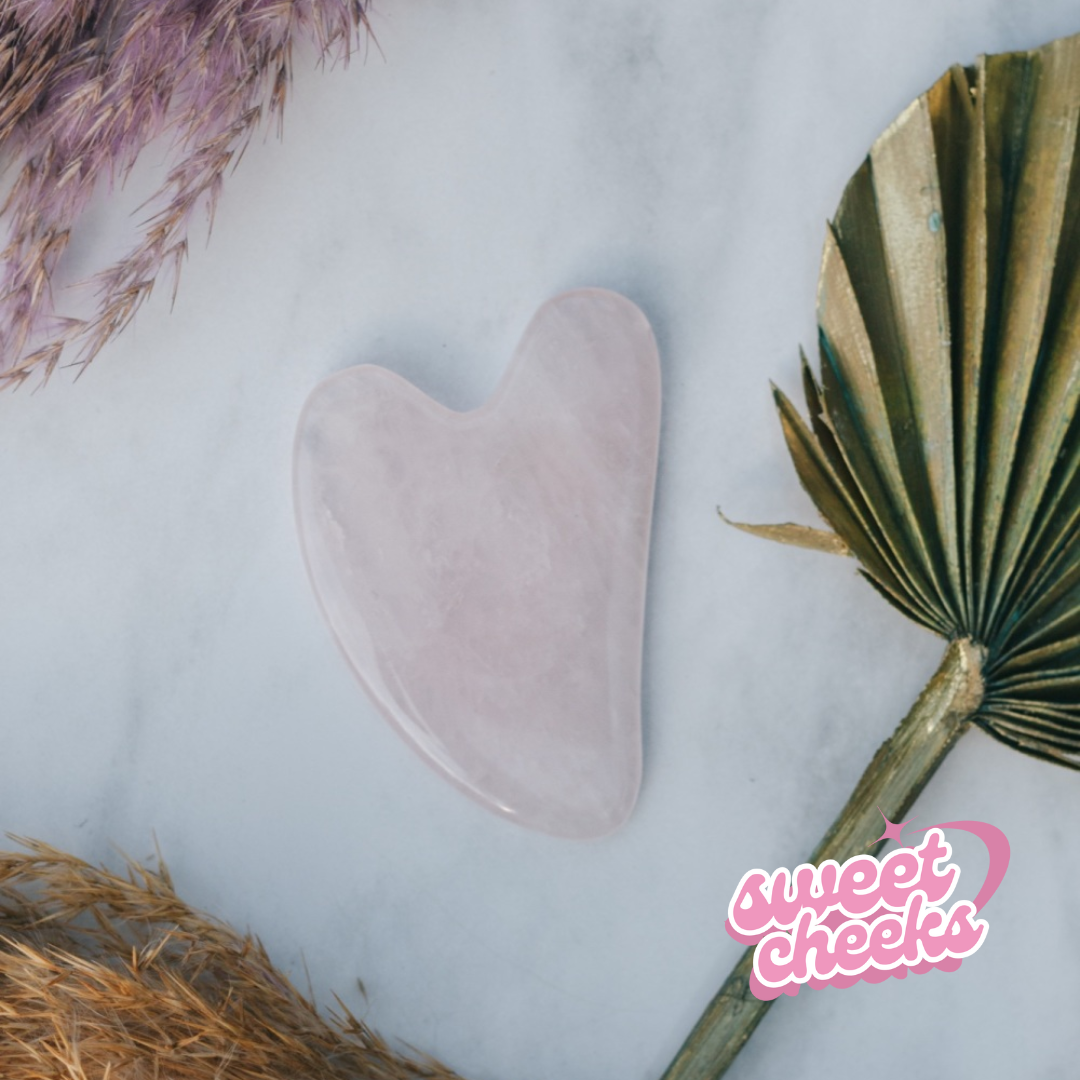 Rose Quartz Crystal Gua Sha with Black Skull Pouch - Sweet Cheeks